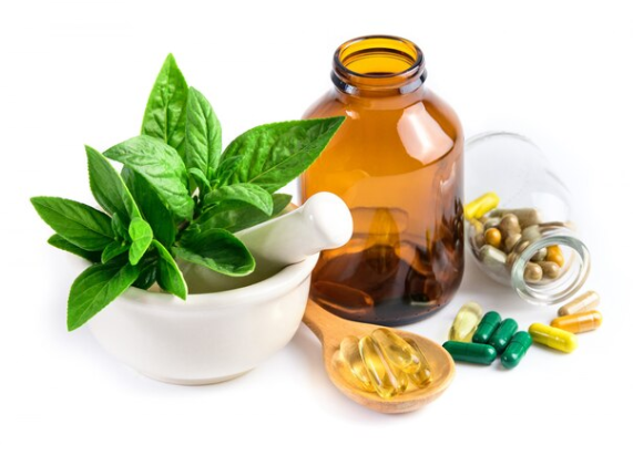Herbal extracts, capsules and mortar with fresh botanicals